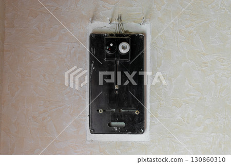 Old electrical fuses box hanging on the wall Old electrical fuses box hanging on the wall 130860310