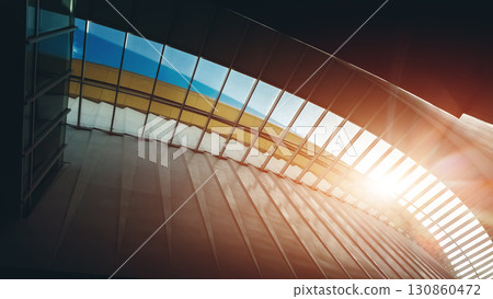 modern glass roof with sleek architectural design and bright transparency, contemporary transparent ceiling featuring innovative urban elegance and natural light flow 130860472