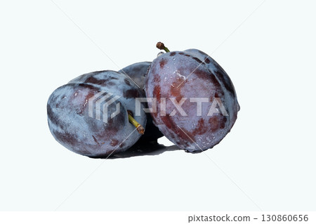 Fresh ripe plums covered with water droplets on white background Fresh ripe plums covered with water droplets on white background 130860656