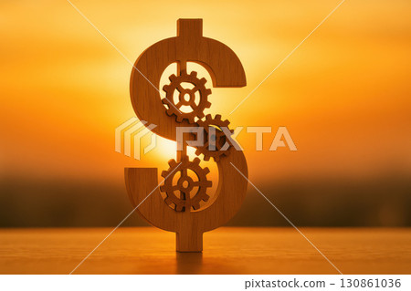 Wooden dollar sign with gears financial mechanism and economic system visualization glowing sunset horizon warm light 130861036