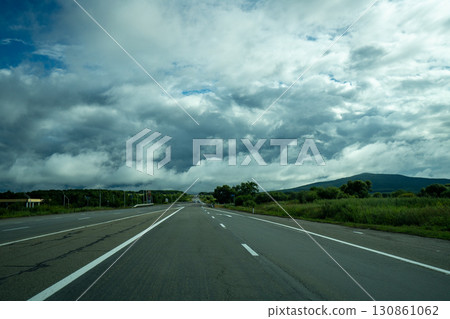 Scenic view of an open road surrounded by nature in Vladivostok, Russia Scenic view of an open road surrounded by nature in Vladivostok, Russia 130861062