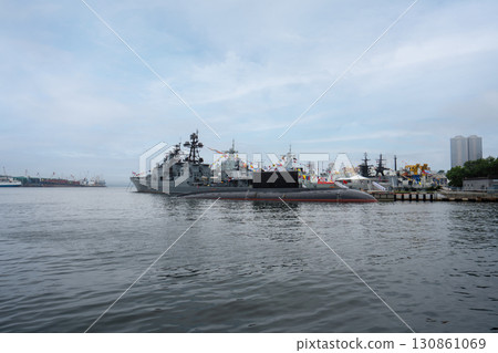 Vibrant port scene in Vladivostok showcasing naval vessels and nature Vibrant port scene in Vladivostok showcasing naval vessels and nature 130861069