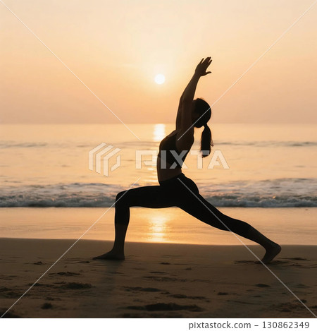 Silhouette of a woman doing yoga on the beach at sunrise 130862349