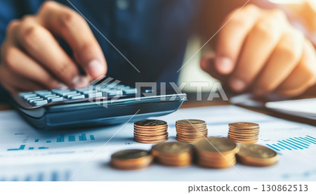 Double Exposure Of Businessman Using Calculator 130862513