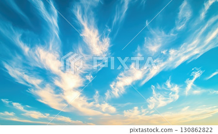 Elegant Golden Strands Of Cirrus Clouds Against A Turquoise Sky Background 130862822