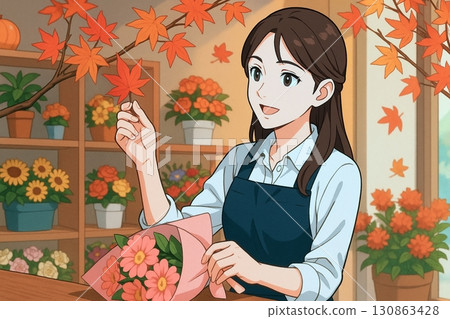 A female florist picking up autumn leaves 130863428