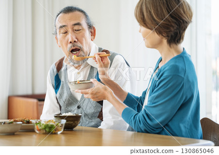 Senior man being fed 130865046
