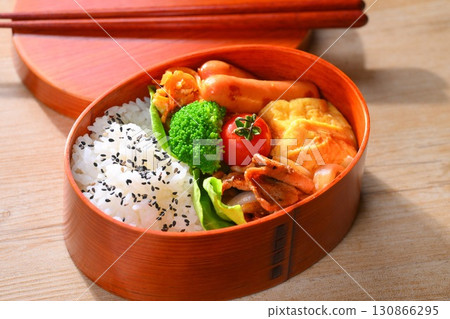 A colorful bento image. Pork shogayaki, Vienna sausage, tamagoyaki (egg roll), shredded carrots, and broccoli. A colorful bento image. Pork shogayaki, Vienna sausage, tamagoyaki (egg roll), shredded carrots, and broccoli. 130866295