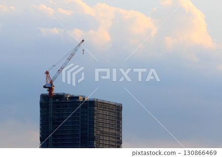 Crane at condominium construction site 130866469