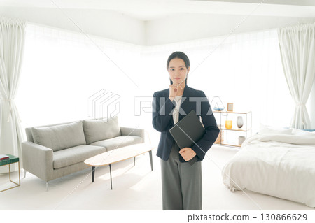 A real estate woman with a troubled expression 130866629