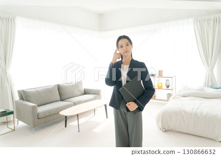 A real estate woman with a troubled expression A real estate woman with a troubled expression 130866632