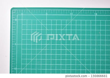green cutting mat board on white background with line and scale measure guide pattern for object art design, tool equipment of diy craft work 130866681
