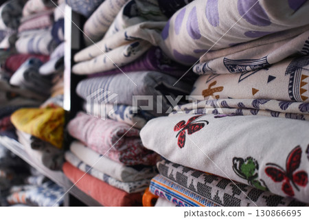 heap of colorful cloth on shelf for sale in store heap of colorful cloth on shelf for sale in store 130866695