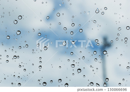 water drop on mirror with blue sky and white cloud background water drop on mirror with blue sky and white cloud background 130866696