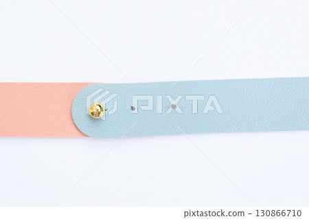 light blue and pink leather strap isolated on white background 130866710
