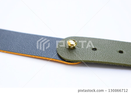 dark blue and green leather strap isolated on white background 130866712