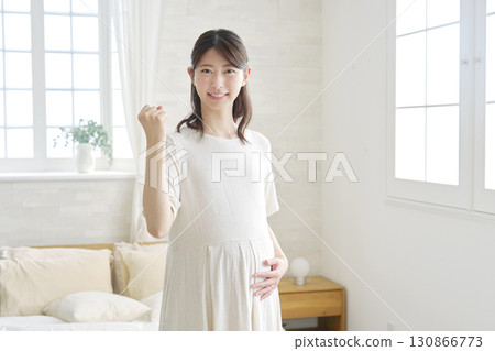 Pregnant woman, fist pump, home 130866773