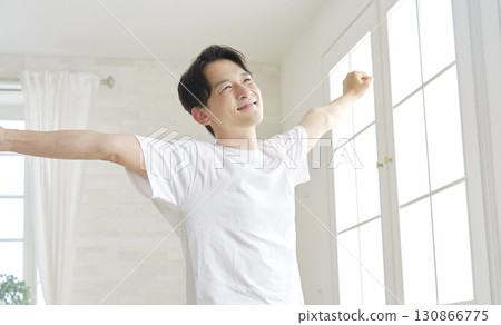 Man stretching at home 130866775