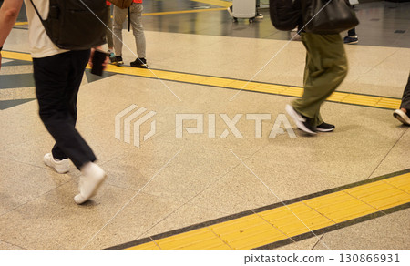 Commuters and tourists walking through the station Commuters and tourists walking through the station 130866931