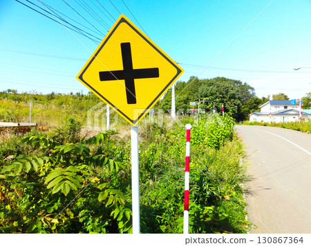 Photographing a road sign in Assabe, Hokkaido in early autumn 130867364