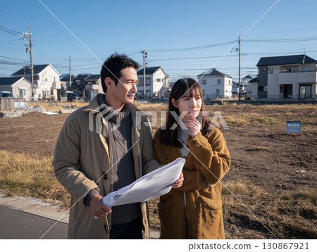 Serious expressions of a couple considering buying a home (land search, housing, real estate) Serious expressions of a couple considering buying a home (land search, housing, real estate) 130867921