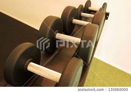 State of many dumbbells in the training room of the sports gym State of many dumbbells in the training room of the sports gym 130868000