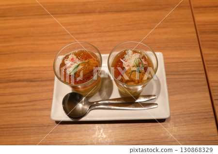 Western-style steamed egg custard with consommé jelly and sea urchin Western-style steamed egg custard with consommé jelly and sea urchin 130868329