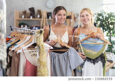Two women shopping in a clothing store 130868559