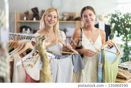 Two women shopping in a clothing store 130868590