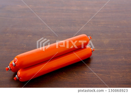 Fish sausage on the table background Fish sausage on the table background 130868923