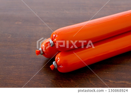 Fish sausage on the table background 130868924