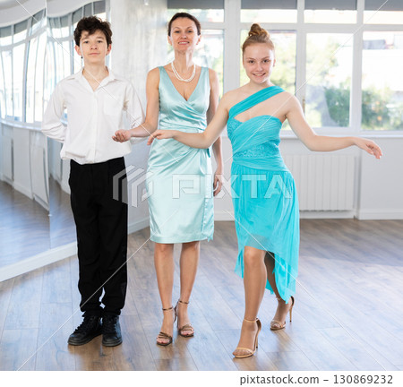 Young dance partners and female mentor bowing after performance Young dance partners and female mentor bowing after performance 130869232