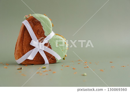Present gift ribbon holiday Valentine's Birthday love symbol Delightful and vibrant heartshaped pastry croissant treat, beautifully topped with colorful frosting nut galore. Mock up template copy Present gift ribbon holiday Valentine's Birthday love symbol Delightful and vibrant heartshaped pastry croissant treat, beautifully topped with colorful frosting nut galore. Mock up template copy 130869360