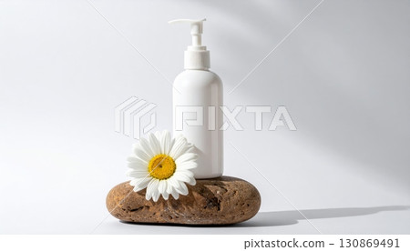 Lotion bottle and minimal chamomile flower 130869491