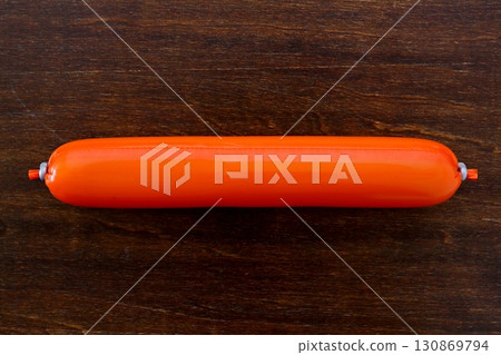 Fish sausage on a table background viewed from directly above 130869794