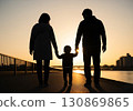 (AI-generated) Family image: Silhouette of a parent and child taking a walk in the setting sun 130869865