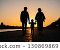 (AI-generated) Family image: Silhouette of a parent and child taking a walk in the setting sun 130869869