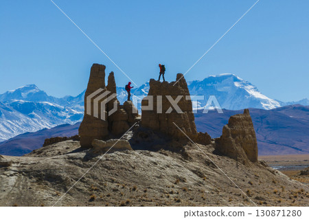 Two women hikers taking photo wiith Mount Everest in Tibet, China 130871280