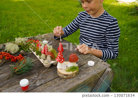 Nature-inspired autumn craft with natural and repurposed materials, depicting a mushroom. 130871634