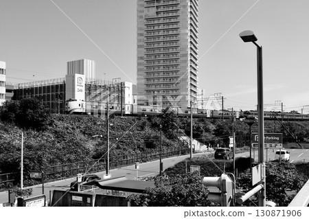 "Limited express train" running with high-rise apartment buildings in the background, east side of Shin-Sapporo Station, "Black and White" 130871906