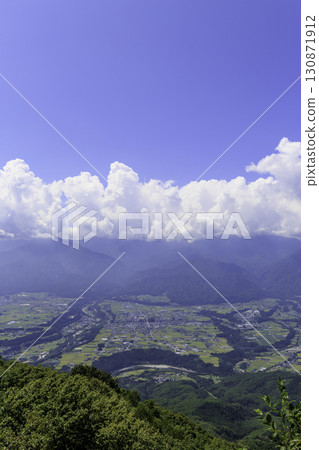 A spectacular view of the Ina Valley from Mount Jimbagata, with the Central Alps covered in summer clouds A spectacular view of the Ina Valley from Mount Jimbagata, with the Central Alps covered in summer clouds 130871912