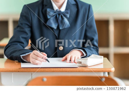 Junior high school and high school girls taking tests in school classrooms and cram school classes 130871962