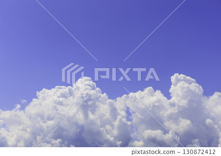 A refreshing skyscape with white cumulonimbus clouds floating in the summer blue sky 130872412