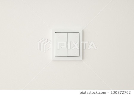 Simple white light switch against plain white wall design Simple white light switch against plain white wall design 130872762