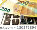 Calculator and Euro Bills. A professional stock photo of 200 euro banknotes on a calculator. 130872894