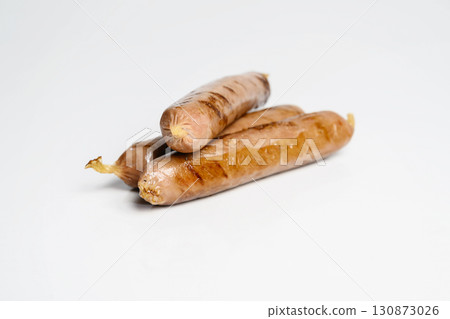 Fried grilled sausage isolated over a white background. Oktoberfest festival 130873026