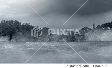 Wet and muddy field with cloudy night and dark sky background. The scene is scary and mysterious. Mockup. Copy Space. Wallpaper or Halloween background Wet and muddy field with cloudy night and dark sky background. The scene is scary and mysterious. Mockup. Copy Space. Wallpaper or Halloween background 130873069