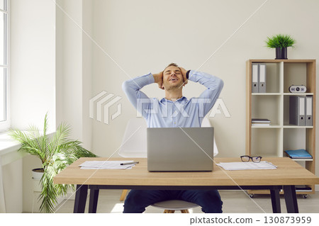 Businessman or corporate employee feels happy and satisfied with successfully completed work Businessman or corporate employee feels happy and satisfied with successfully completed work 130873959