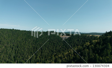 Aerial view of green mountain ridges and forested valleys in Divcibare, Serbia 130874304