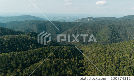 Aerial view of green mountain ridges and forested valleys in Divcibare, Serbia Aerial view of green mountain ridges and forested valleys in Divcibare, Serbia 130874311